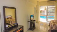Fully furnished apartment rental with Flat Screen TV, Dressing Table, Closet / Wardrobe, Dining Table and Sofa etc.