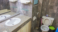 Two bathrooms with bathtubs and sink in Nirun condo for rentals.